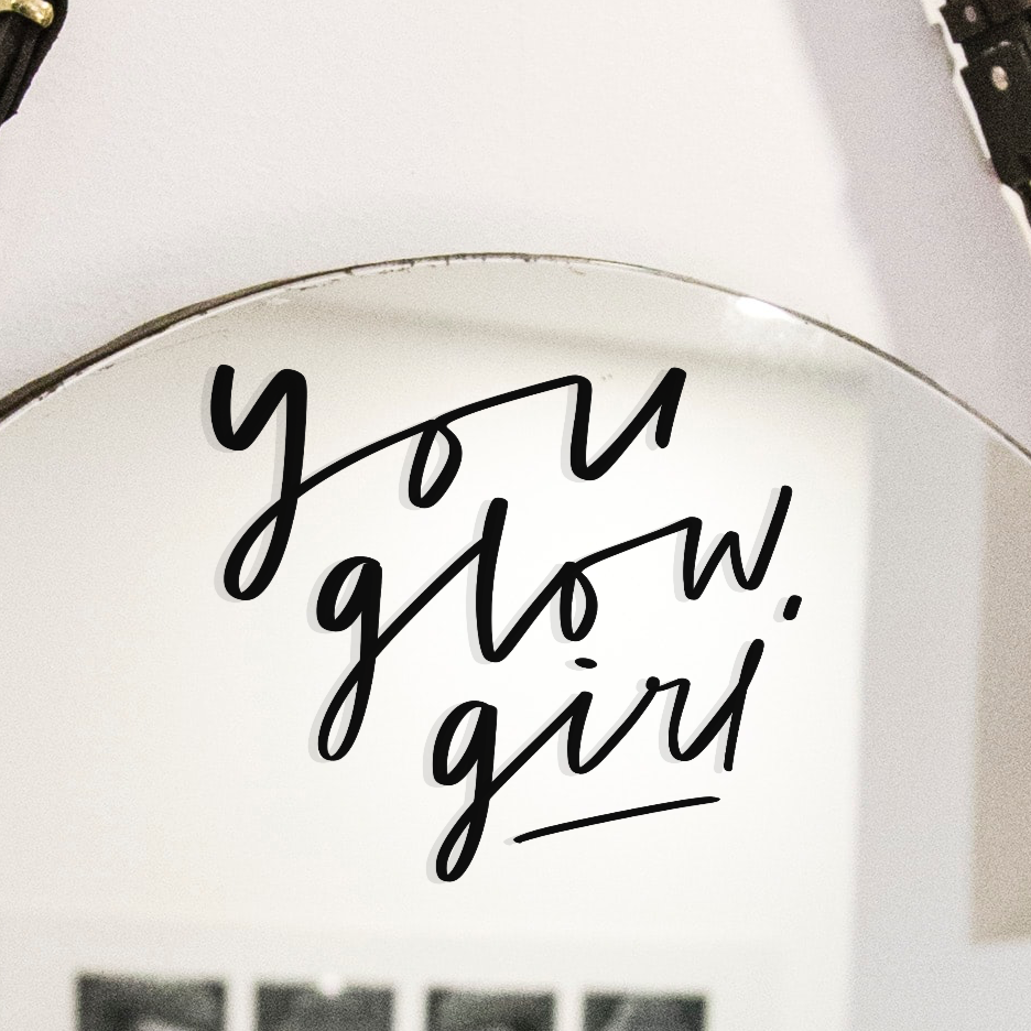 Vinyl mirror decal reading "You Glow, Girl"